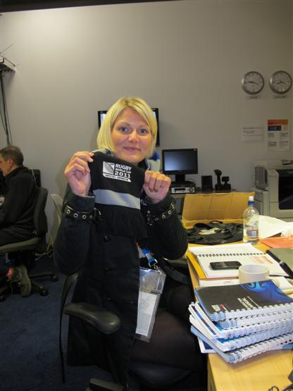 Isabelle makes use of the Rugby World Cup scarfe to keep warm.