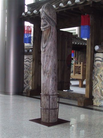 Phallic totem pole in IBC foyer