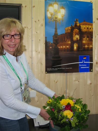 Pauline gets some flowers from the Germans