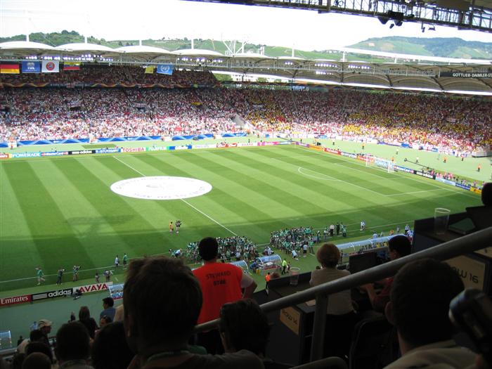 The Ecuador Fans in yellow, hopelessly outnumbered by English fans who have the rest of the Stadium.