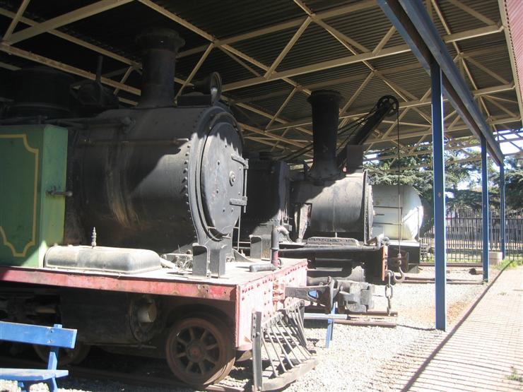 Two steam engines, a steam crane and the white thing is a 'fireless' steam engine.