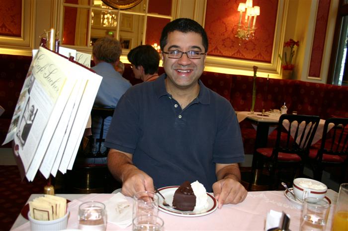 Sanjiv with his torte in Café Sacher